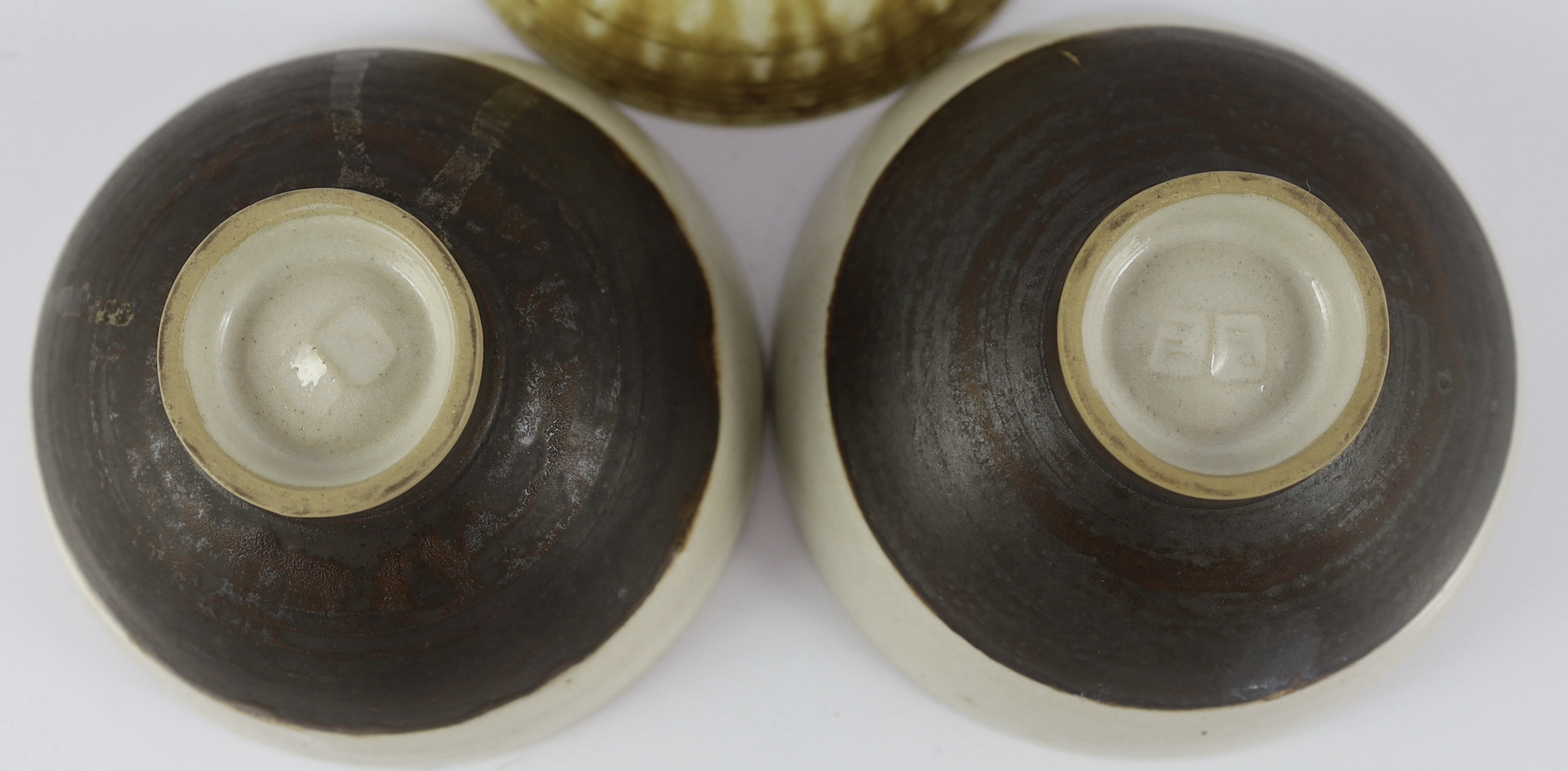 Dame Lucie Rie D.B.E. (1902-1995) and Hans Coper (1920-1981), a pair of stoneware bowls and a third stoneware bowl by Dame Lucie Rie